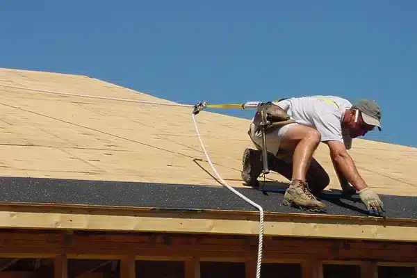 Roofer Using FrenchCreek Full Body Harness & Rope Grab
