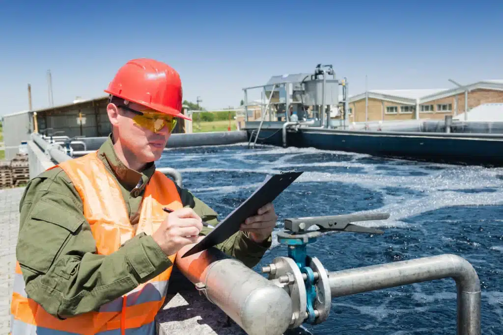 Worker At Wastewater Treatment Plant