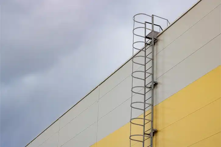 Caged Ladder On Side Of Building
