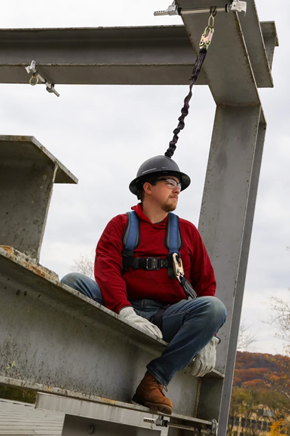Worker wearing FrenchCreek STRATOS Fall Protection Harness And Lanyard