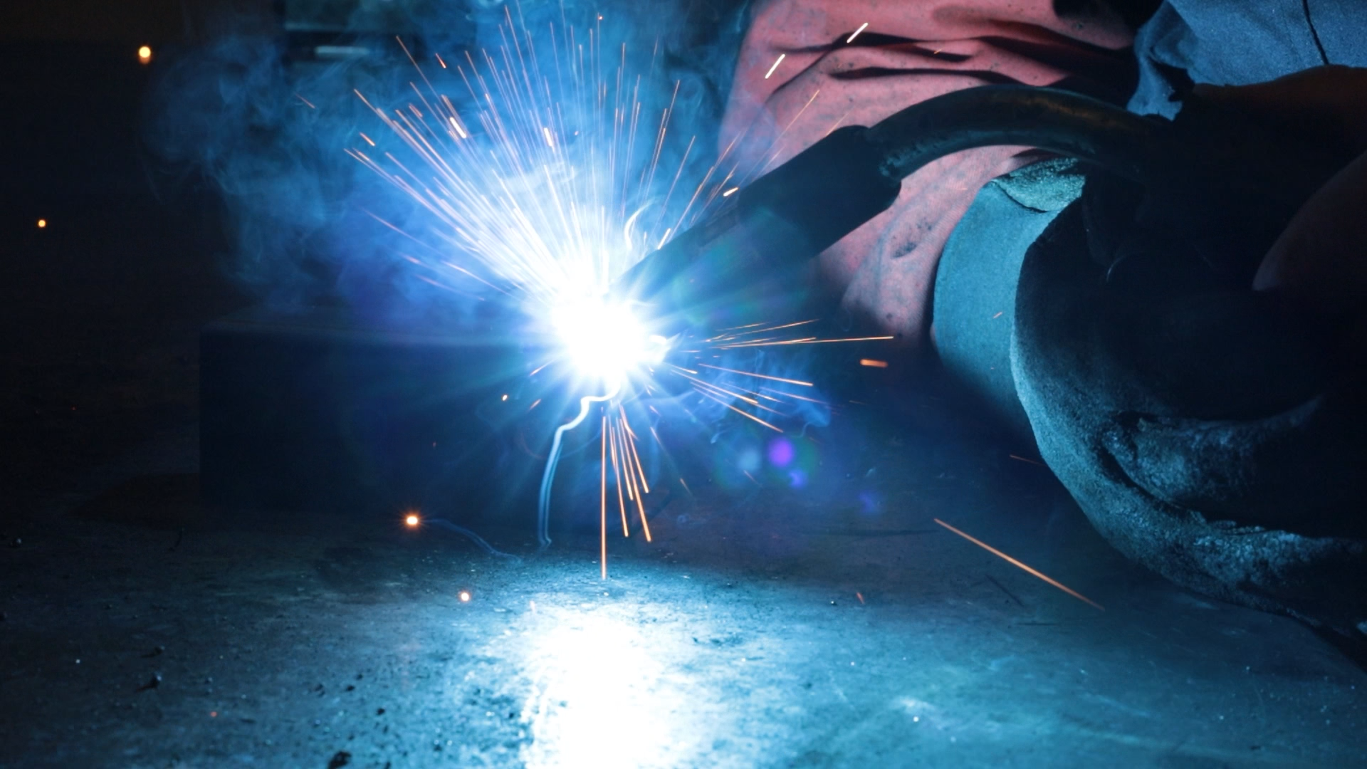FC Safety employee using a welder to fabricate metal fall-protection equipment
